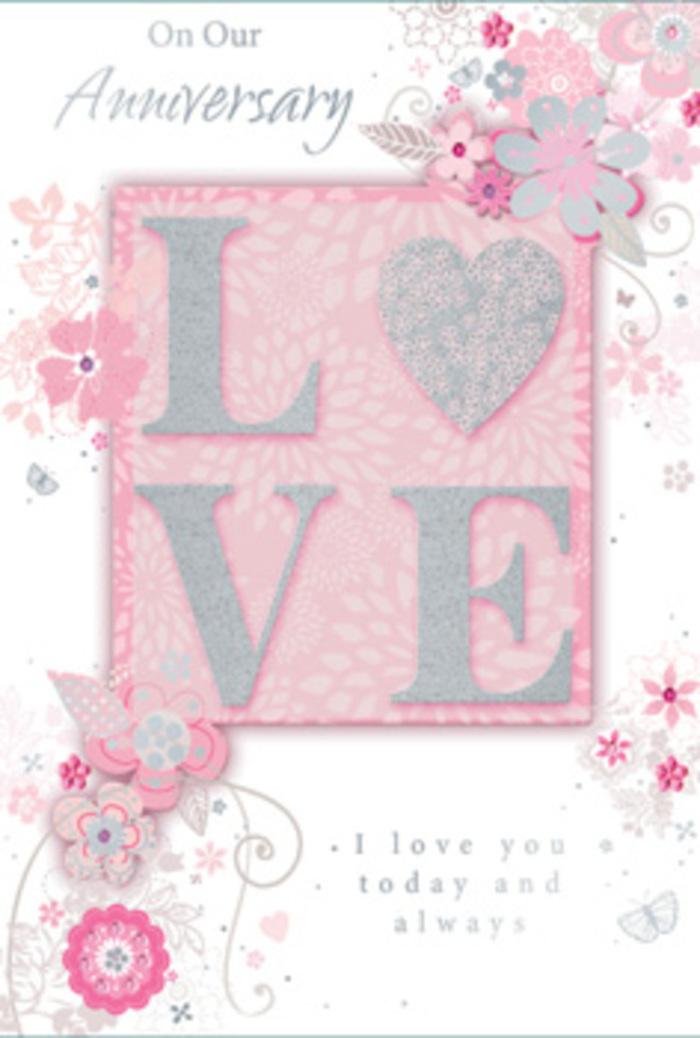 The anniversary card in the image presents a beautifully balanced composition that could almost be the storyboard for an exquisite floral display crafted locally in North Kensington. Dominating the centre is the word LOVE, each capital letter slightly raised above the surface, its edges catching the light thanks to a dusting of fine, silver-toned glitter. The interior of the letters appears softly frosted, not overly shiny, giving a refined sheen that suggests careful craftsmanship rather than showy sparkle. This central motif sits on a blush-pink ground that is smooth and consistent, gently transitioning in tone at the edges so the middle appears subtly illuminated. Around 'LOVE,' a delicate tangle of illustrated flowers, leaves, and swirling lines curves outward like an unfolding bouquet. The blossoms are stylised, with thin outlines and shaded interiors in pale pinks, off-whites, and muted greys, echoing the understated romance of pastel roses and seasonal blooms you might find in an anniversary arrangement delivered to a flat near Notting Hill Gate. Slender vines and tendrils loop around the letters, some forming circular arcs, others trailing gracefully towards the card's corners. Here and there, small touches of silver foil or glitter accent individual petals and curls, providing dimension and a sense of quiet movement. A heartfelt anniversary message in a script-style font sits neatly towards the bottom, its elegant lettering weaving visually into the floral scrolls. The card's overall mood is soft, intimate, and enduring-like a keepsake bouquet on paper, ideal for expressing ongoing love in North Kensington's characterful urban setting.